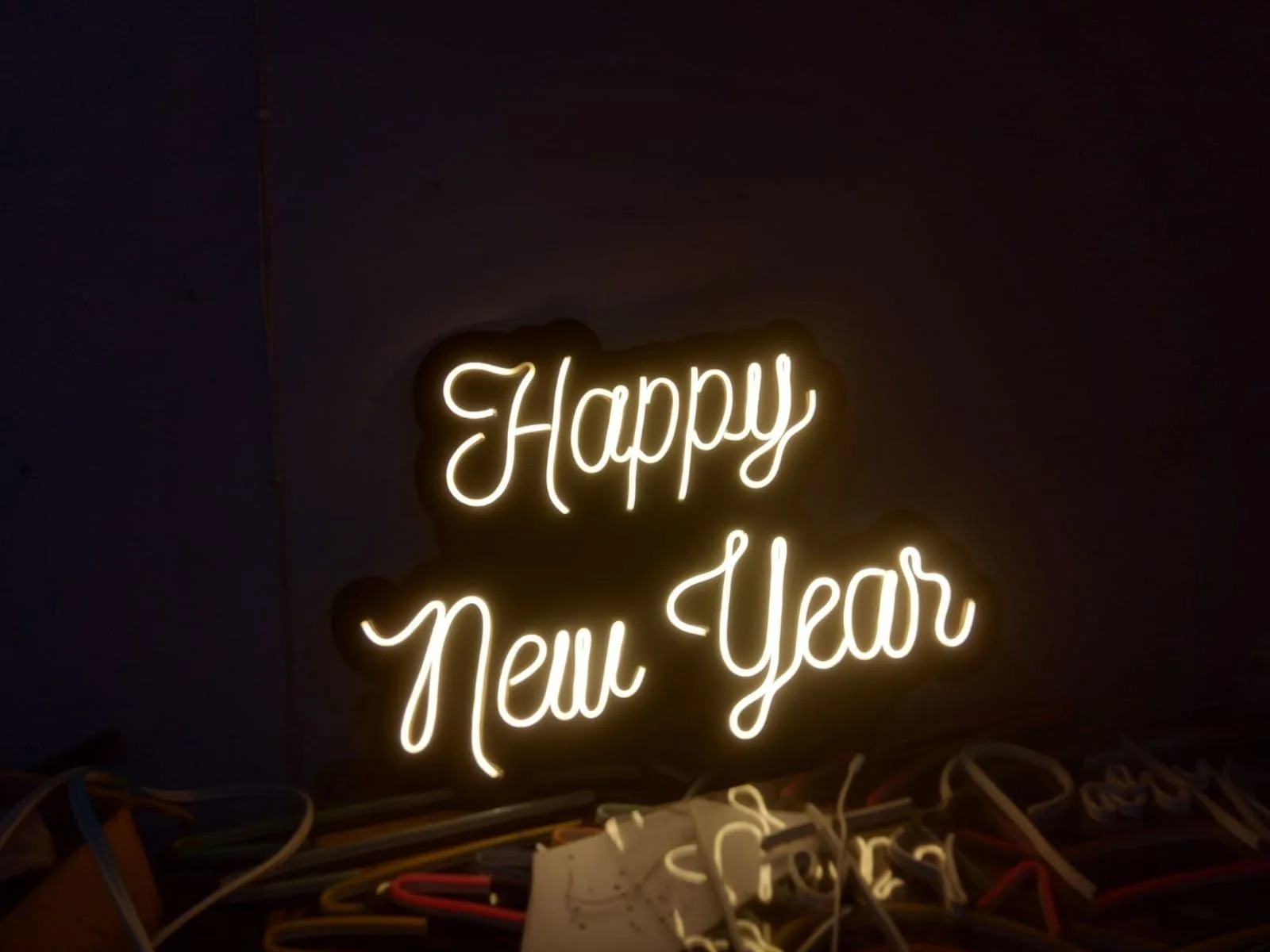 Warm white LED neon flex script sign lit up, made in the Bayan Signage factory