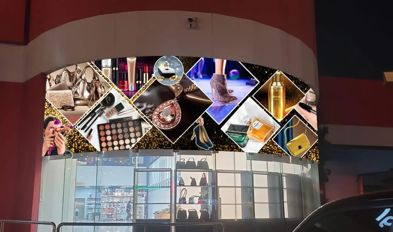 Printed display graphics wrapped around a curved mall shopfront arch