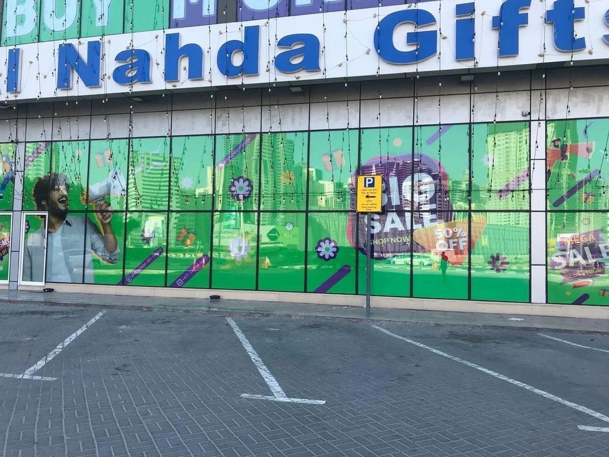 Full printed window graphics covering a gift shop frontage, printed in our Ajman factory