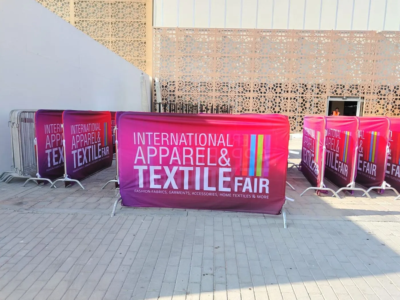 Printed PVC banners fitted to crowd barriers at an exhibition fair entrance