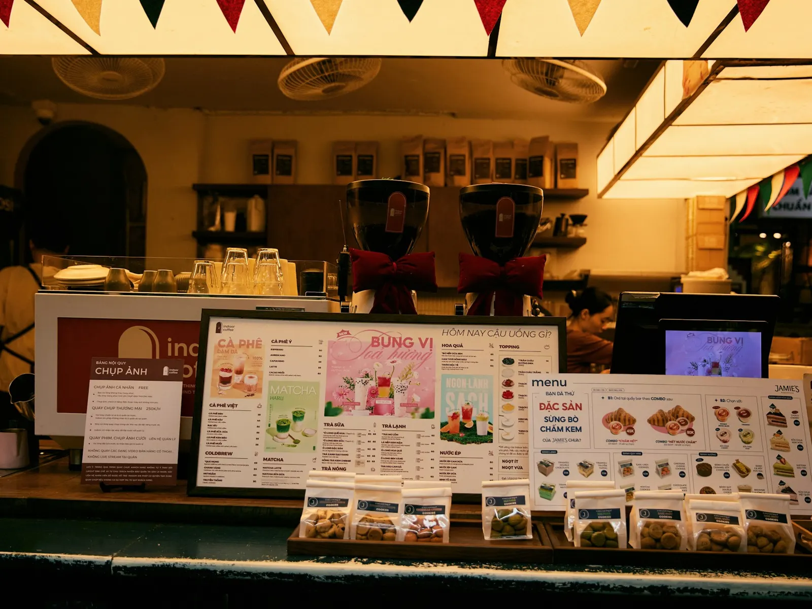 Cafe service counter with printed countertop display stands and menu cards