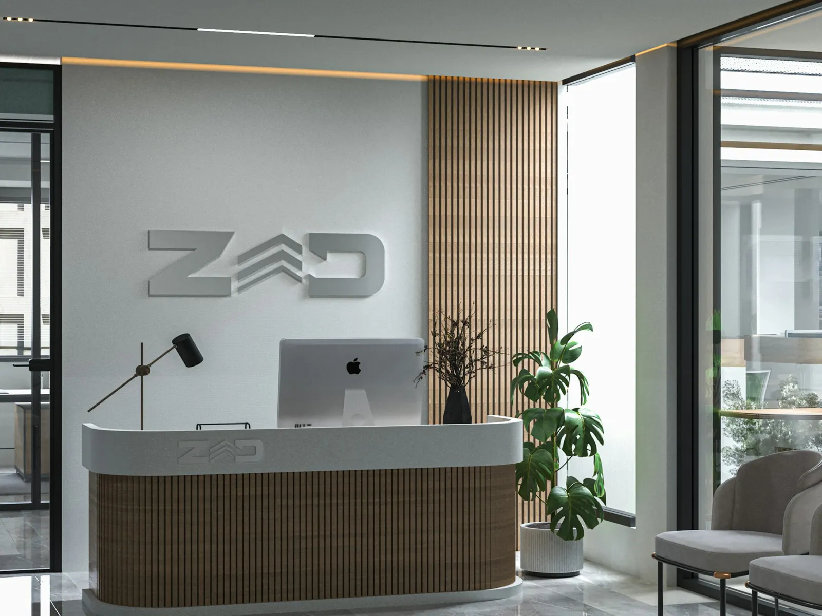 Modern office reception with dimensional company name sign on the wall behind the desk
